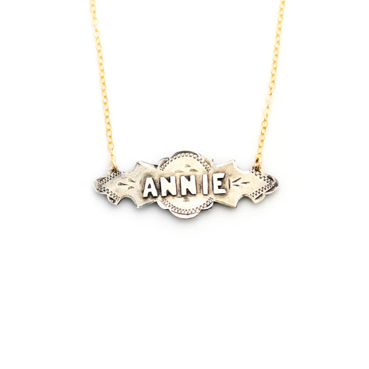This one-of-a-kind conversion necklace is made up of:  Sterling silver Edwardian bar pin pendant from the early 1900s with hand engraved details and the name "ANNIE".
