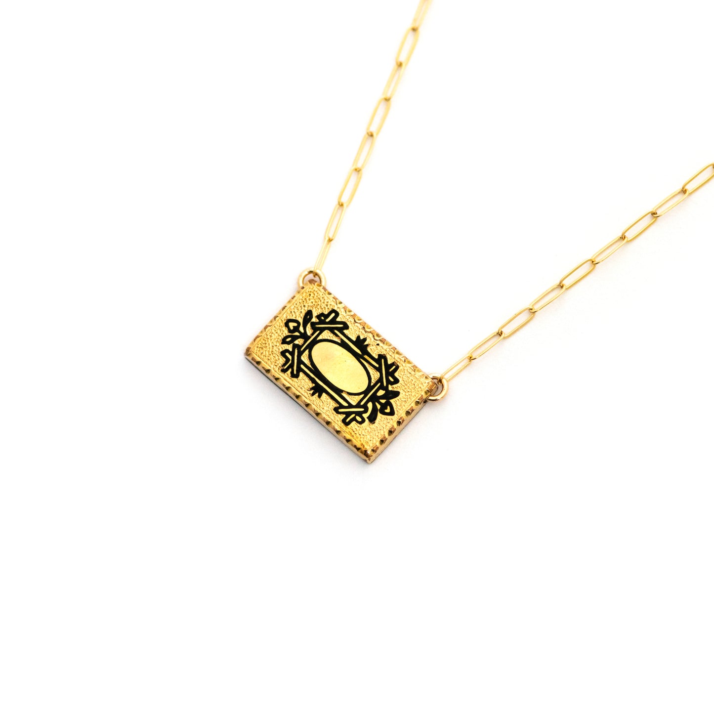 This one-of-a-kind conversion necklace is made up of: Gold filled Victorian cuff link from the late 1800s with hand tooled details and black enamel tracery (taille d'epargne) forming the shape of a frame.