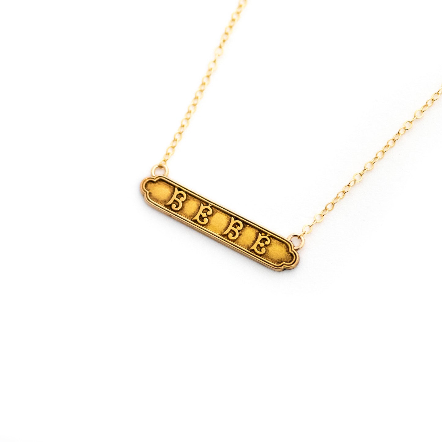 Gold filled antique Victorian baby bar pin pendant from the late 1800s with the French word "BEBE".