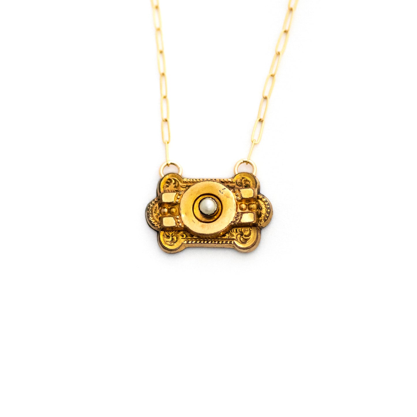 This one-of-a-kind conversion necklace is made up of: Gold filled Victorian brooch pendant from the late 1800s with hand tooled details and a genuine seed pearl