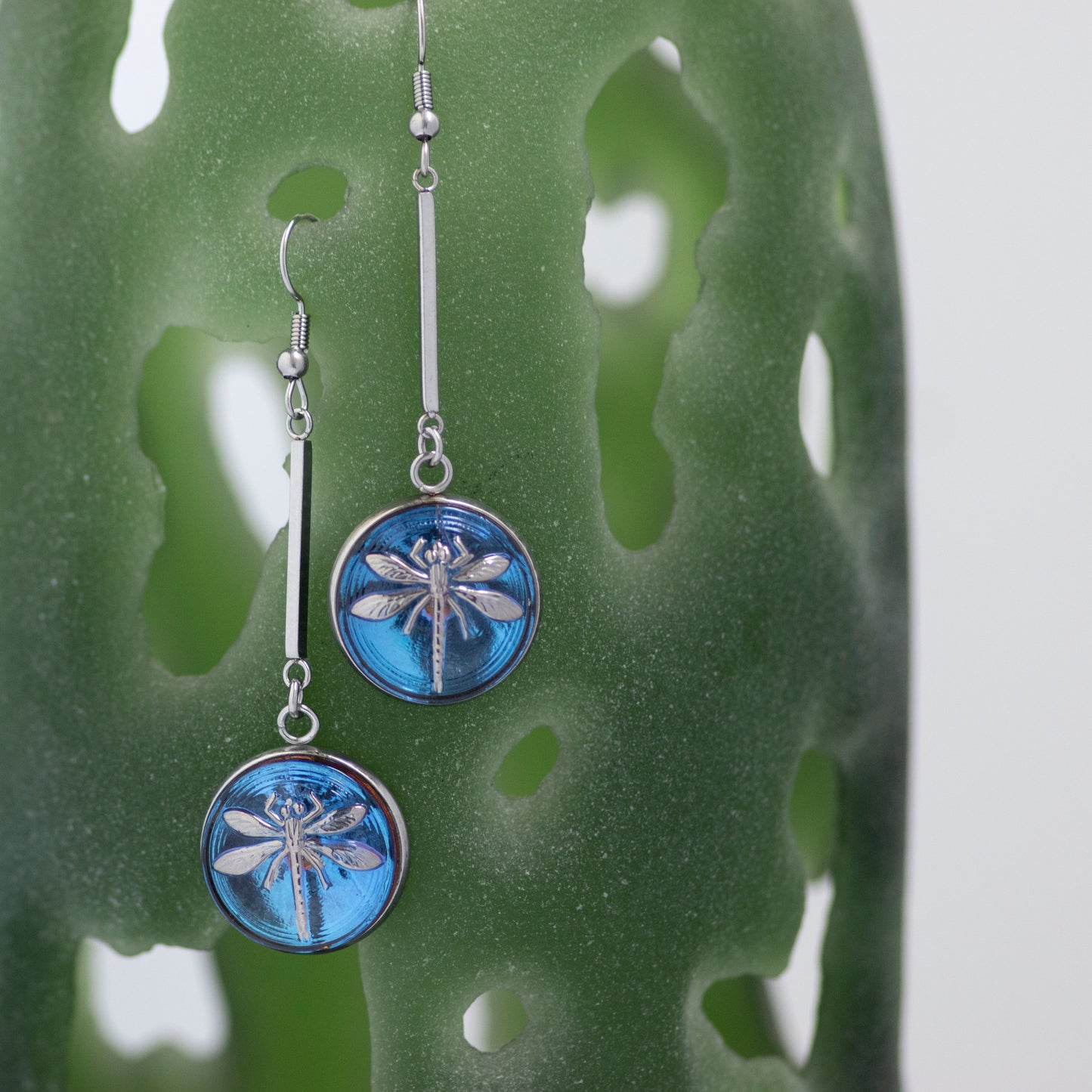 Blue and platinum painted Czech glass button drop dangle earrings.