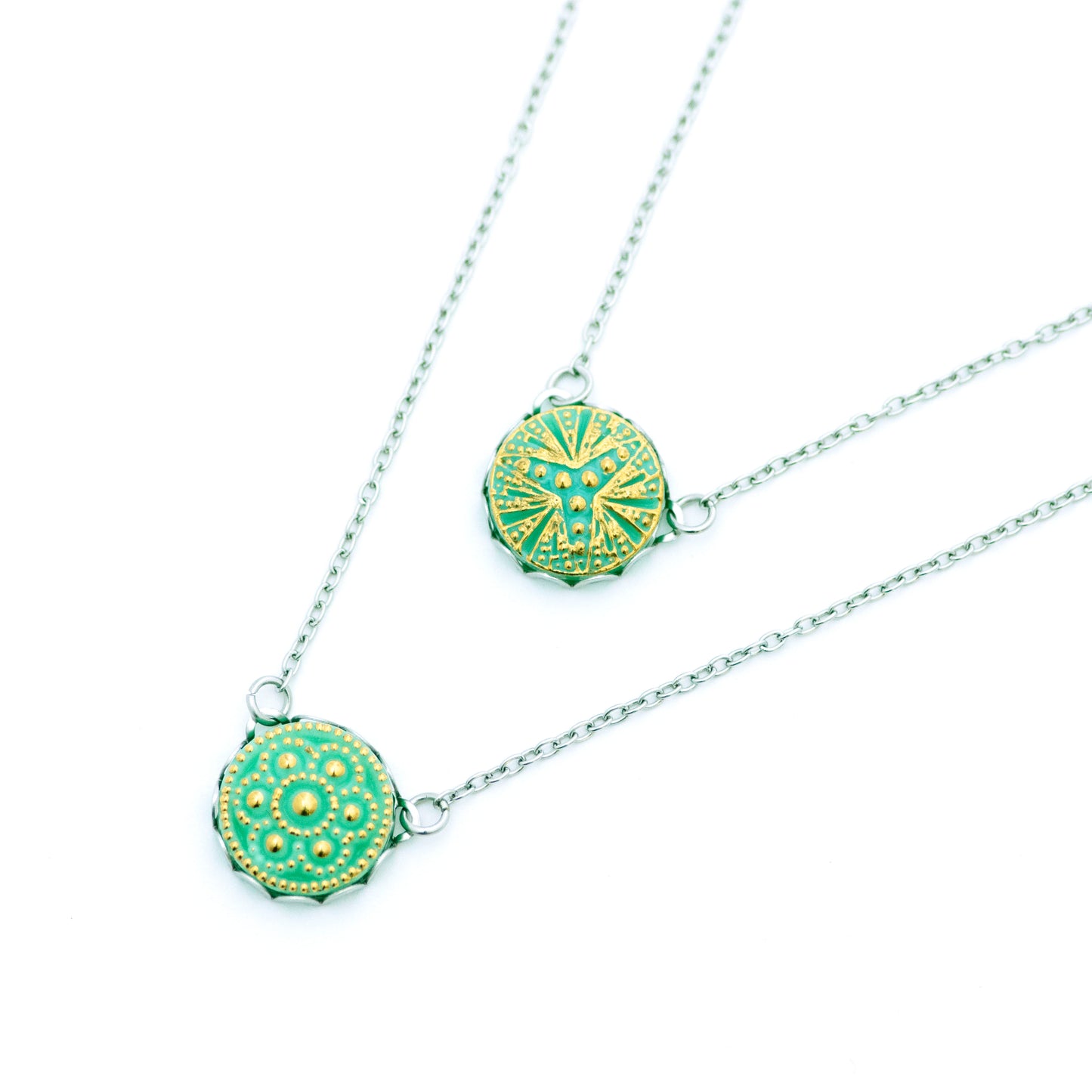 Light turquoise Czech glass button with three point bursting star. Button pendant necklace. Uranium glass button contains 2% uranium dioxide. This small amount in the glass allows it to fluoresce (glow) green under a black light and is also safe to wear.
