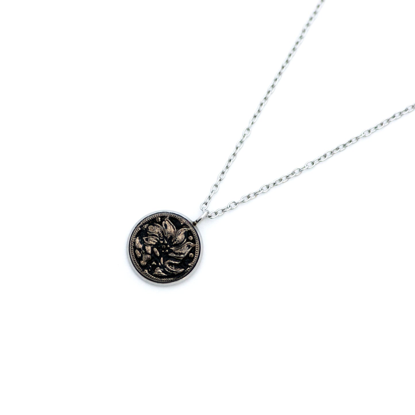 Black and silver platinum painted Czech glass button with lily lotus flower. Button pendant necklace.