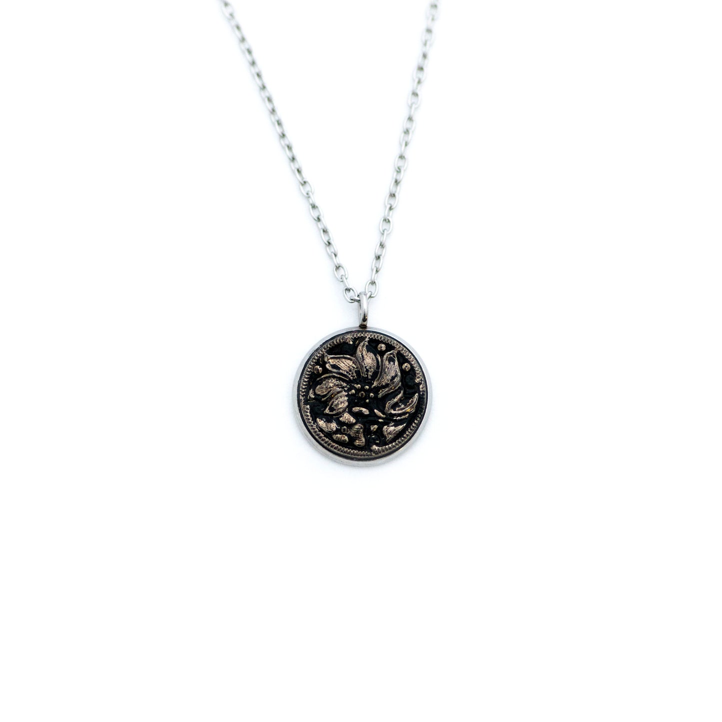 Black and silver platinum painted Czech glass button with lily lotus flower. Button pendant necklace.
