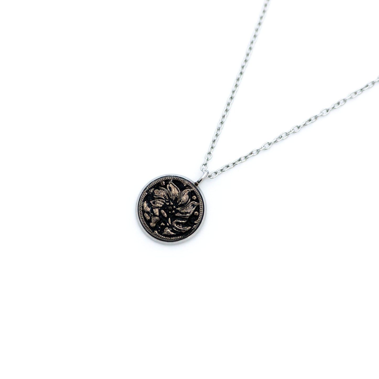 Black and silver platinum painted Czech glass button with lily lotus flower. Button pendant necklace.