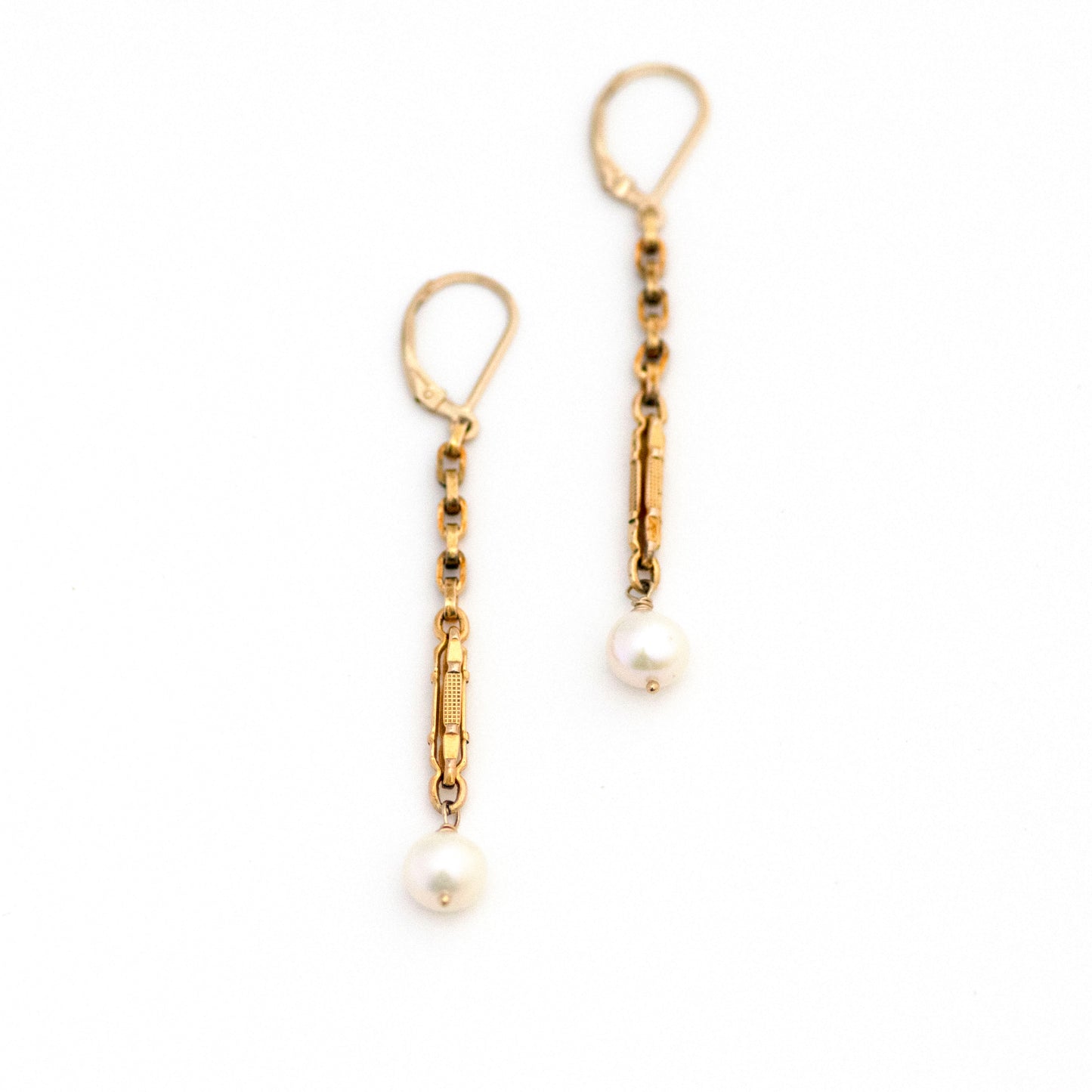 This one-of-a-kind conversion necklace is made up of: Gold filled Edwardian watch chain links from the early 1900s with dangling freshwater pearls.