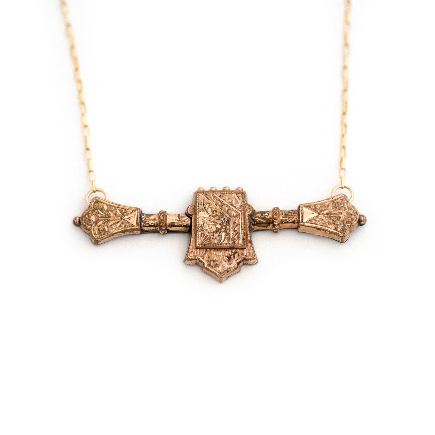 This one-of-a-kind conversion necklace is made up of: Gold filled Victorian bar pin pendant from the late 1800s with hand tooled details including floral accents.