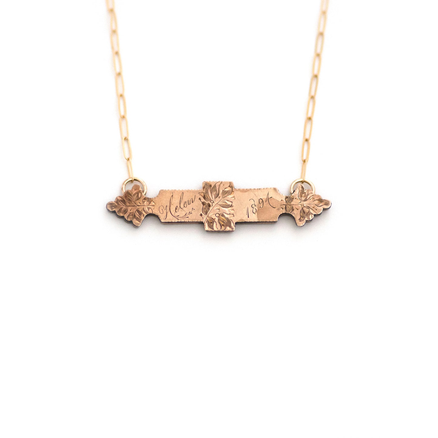 This one-of-a-kind conversion necklace is made up of: Gold filled Victorian bar pin pendant from the late 1800s with floral details, the name "Helen", and the year "1894".
