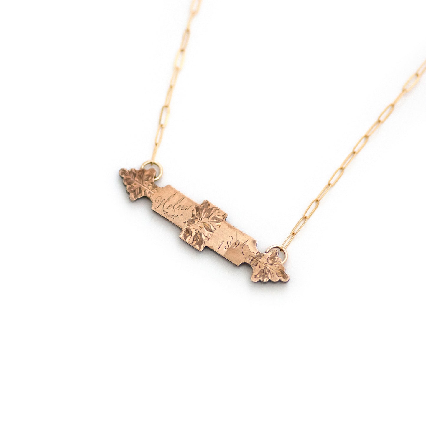 This one-of-a-kind conversion necklace is made up of: Gold filled Victorian bar pin pendant from the late 1800s with floral details, the name "Helen", and the year "1894".