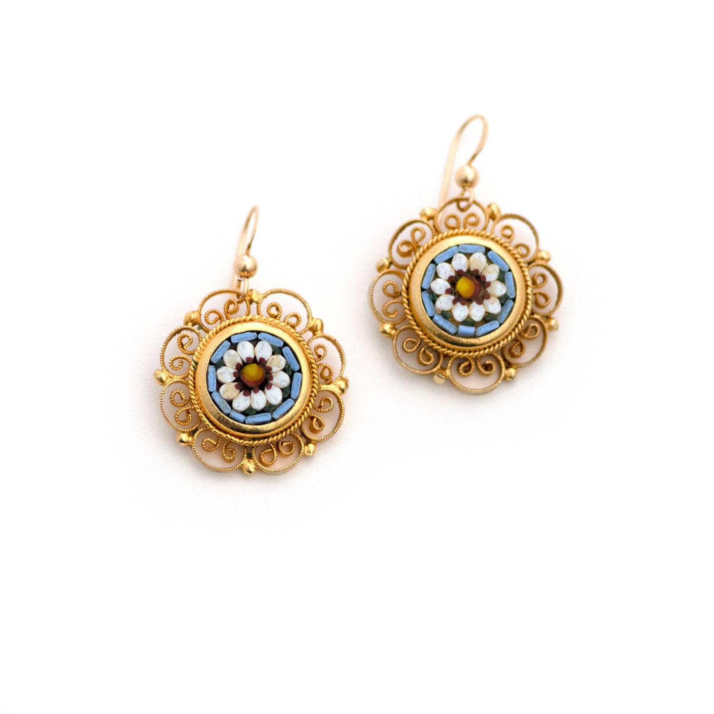 A pair of beautiful gold-tone vintage Italian micro mosaic screw back earrings has been converted into earrings for pierced ears. Micro mosaic glass puzzle depicts white flowers against a baby blue background.