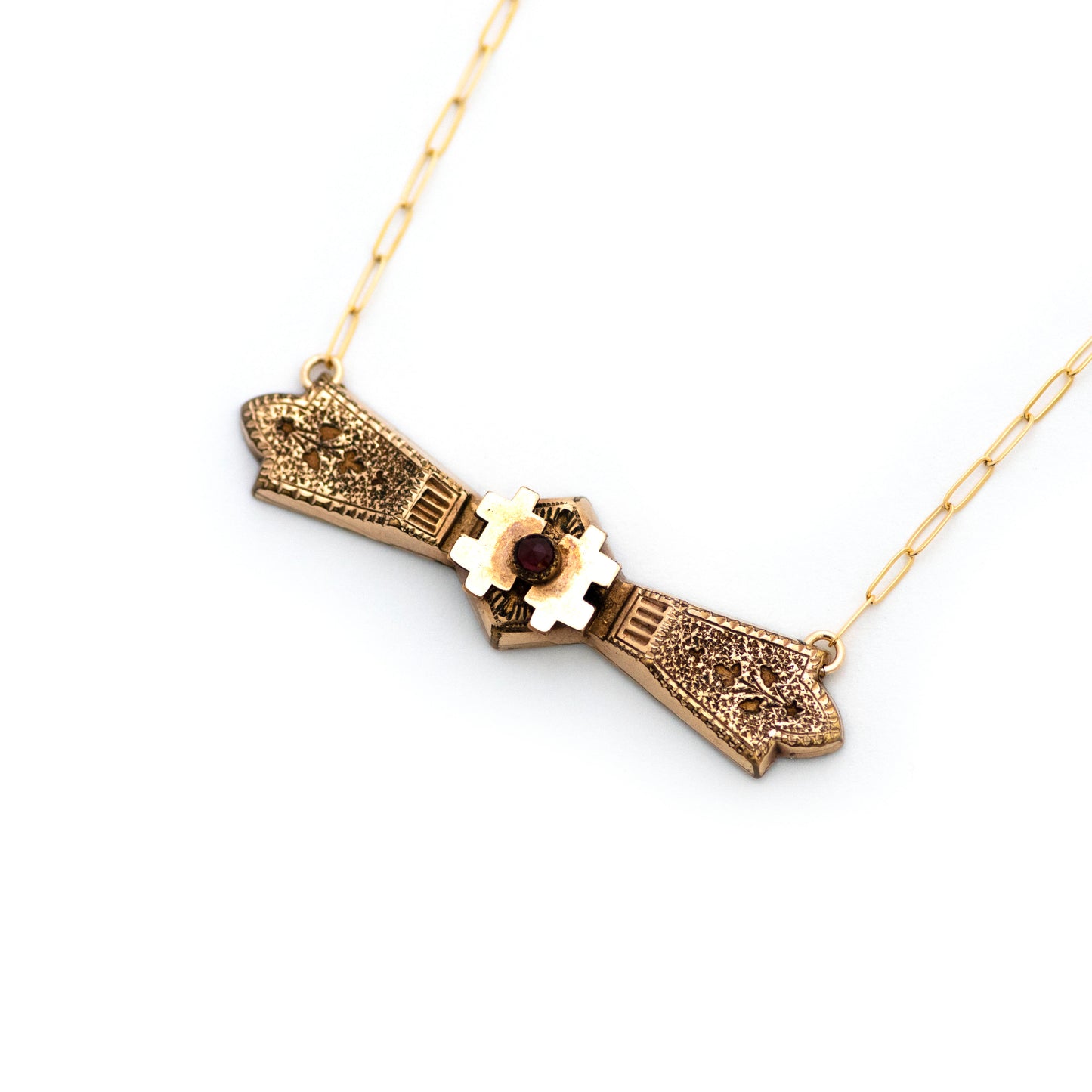 This one-of-a-kind conversion necklace is made up of:  Gold filled Victorian bar pin pendant from the late 1800s with hand engraved floral details and a Bohemian pyrope garnet at the center.