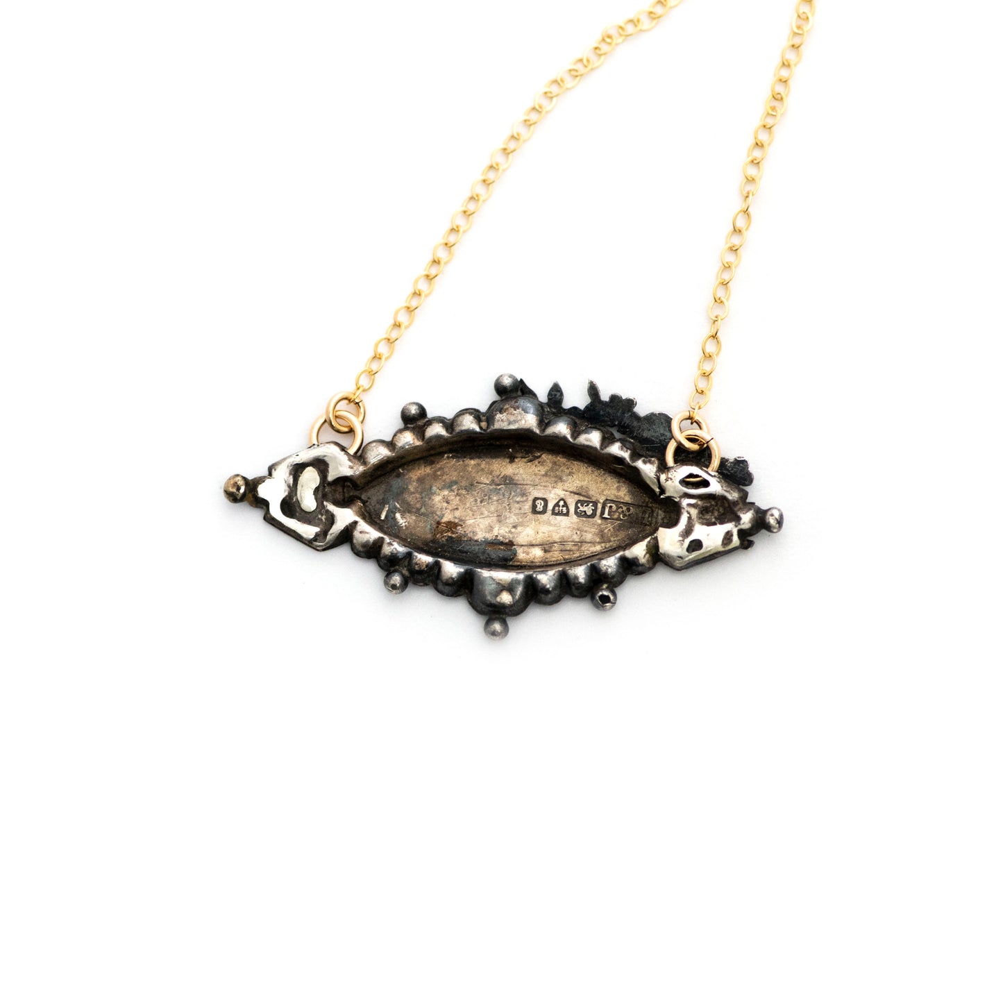 This one-of-a-kind conversion necklace is made up of:  Sterling silver Victorian brooch pendant from the late 1800s with hand tooled details and gold filled letters spelling "LOUIE". Birmingham hallmarks on the back.