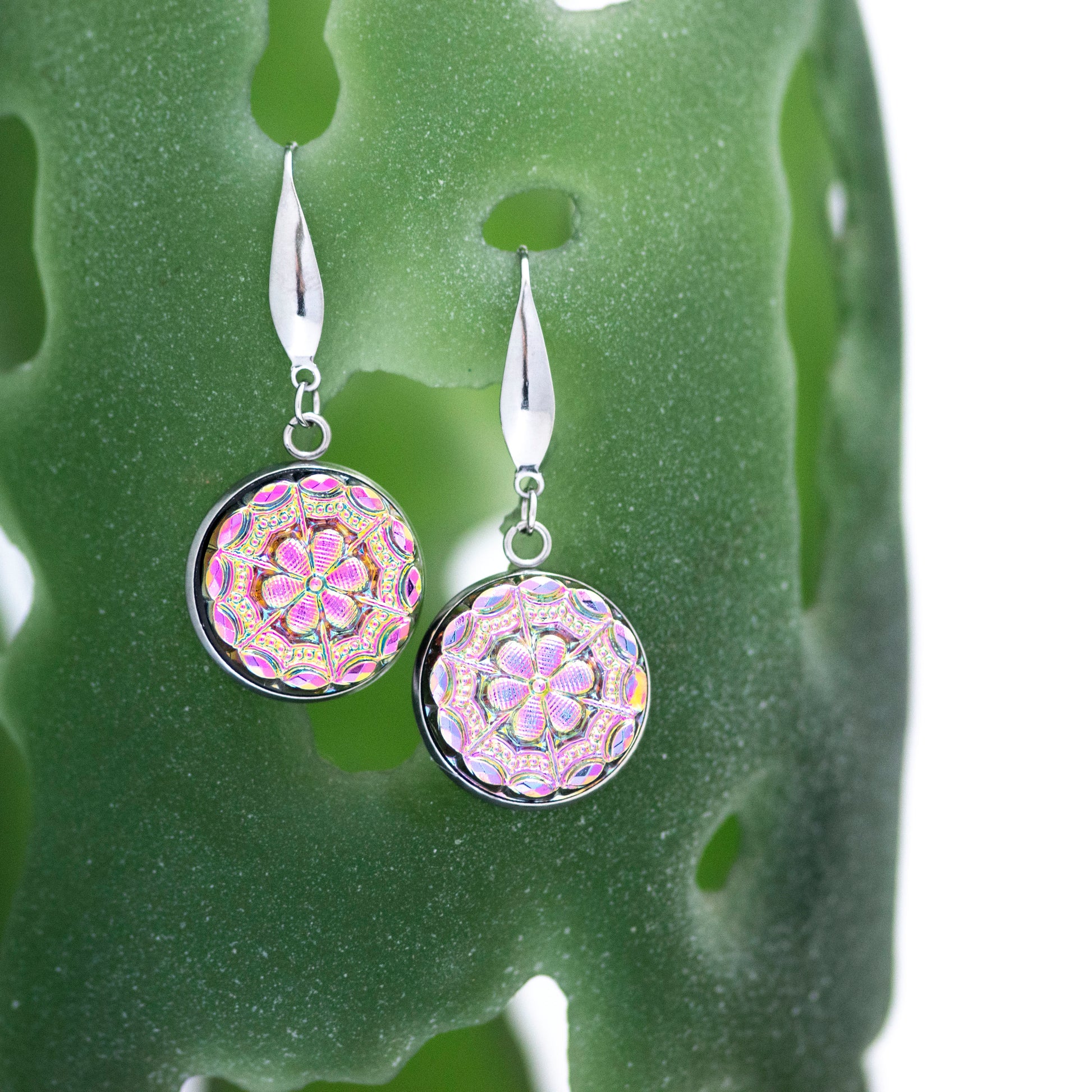 Flashy iridescent pink and green Czech glass buttons in antique relief. Dangle earrings.