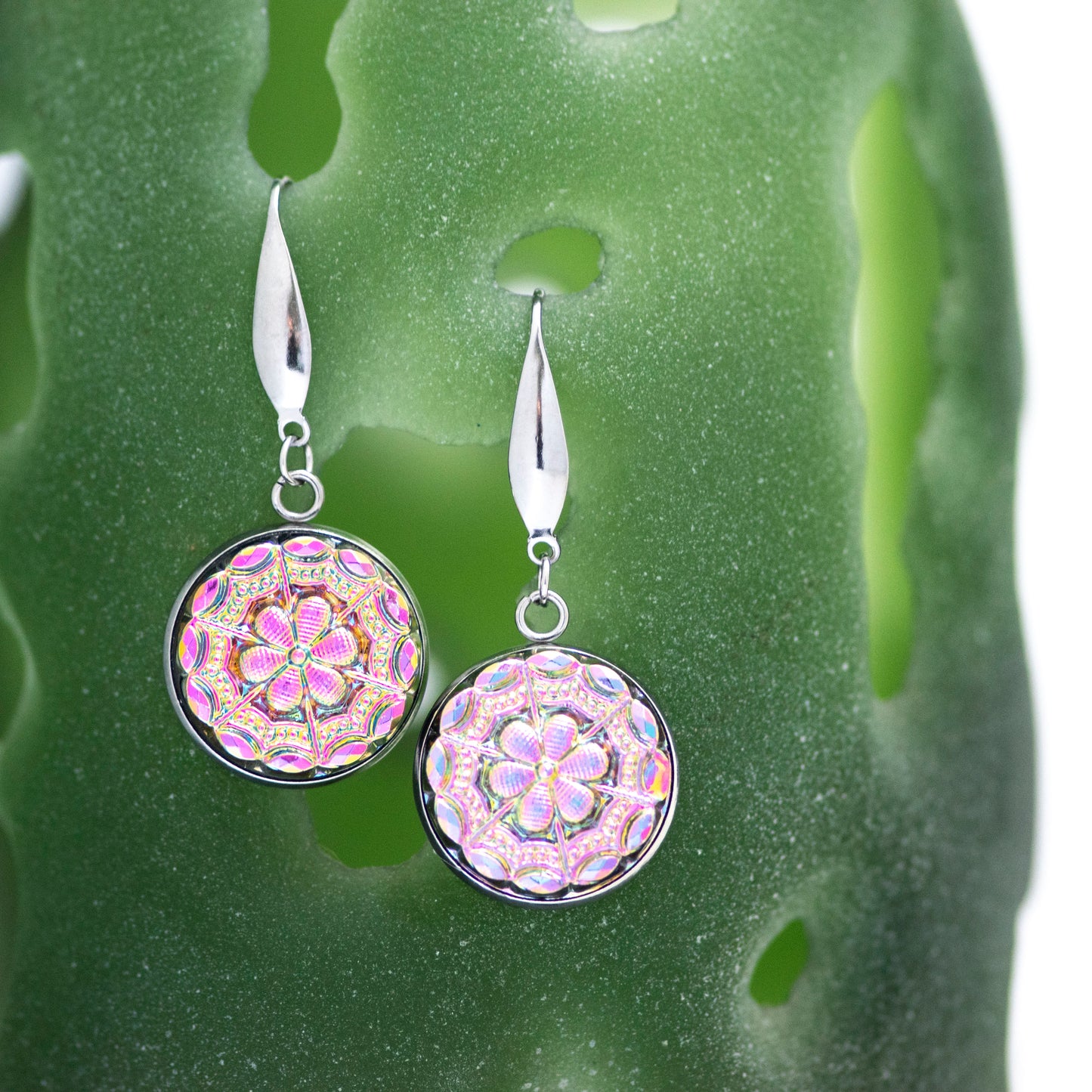 Flashy iridescent pink and green Czech glass buttons in antique relief. Dangle earrings.