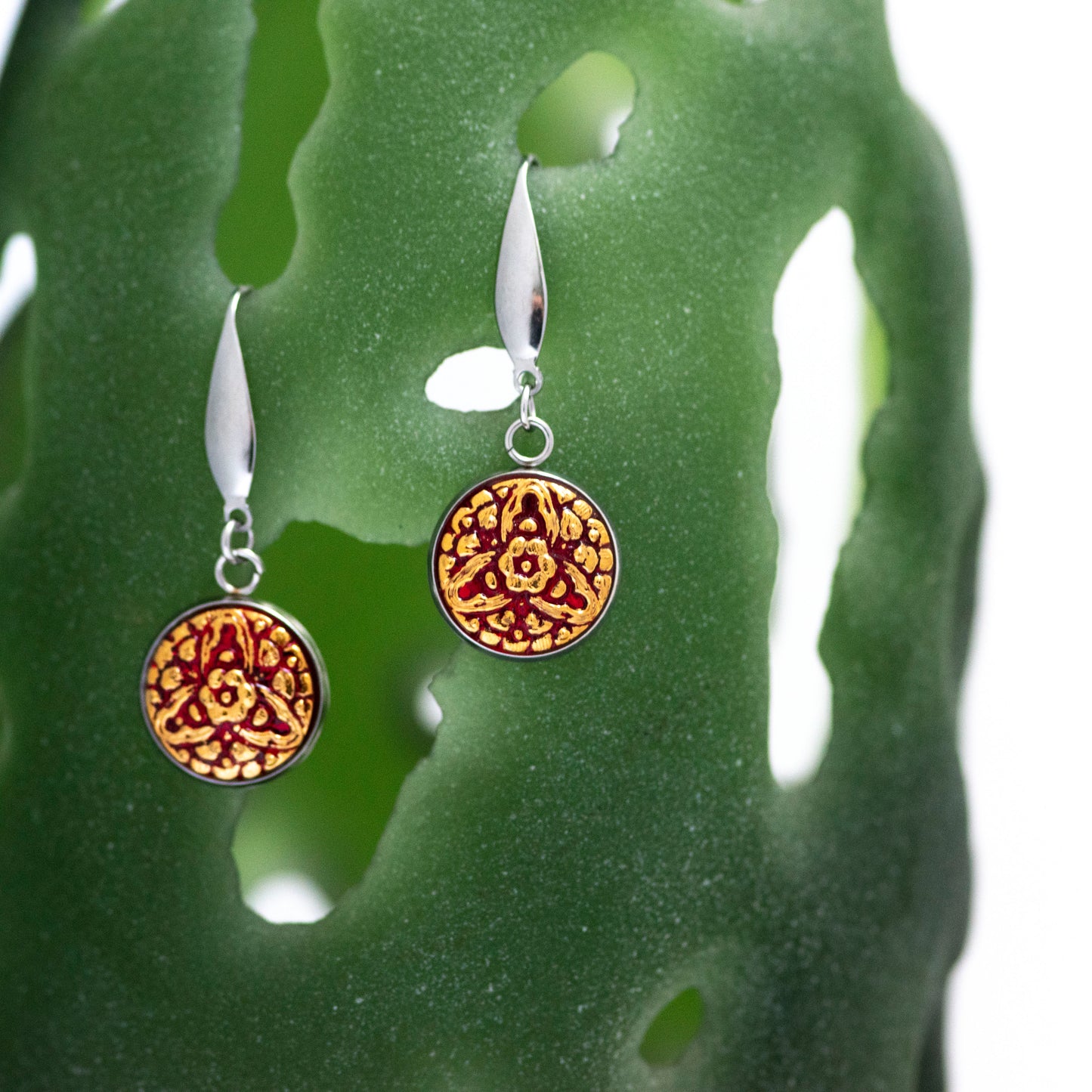 Red and 24k gold painted Czech glass buttons dangle earrings.