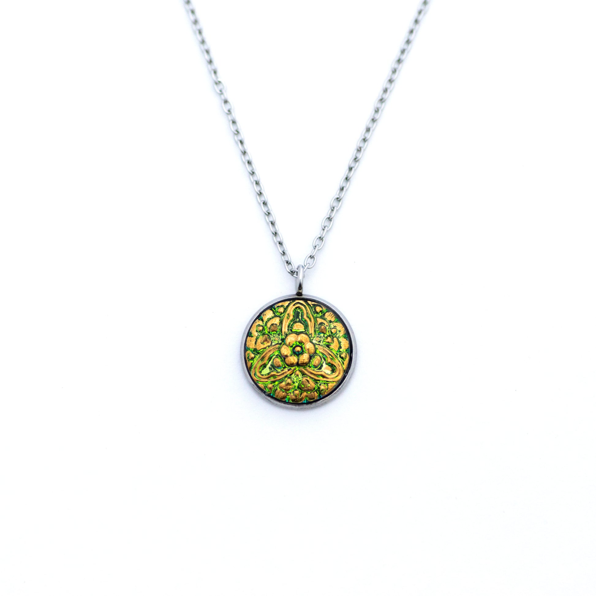 Green and gold painted Czech glass button with 3 point floral motif. Button pendant necklace.