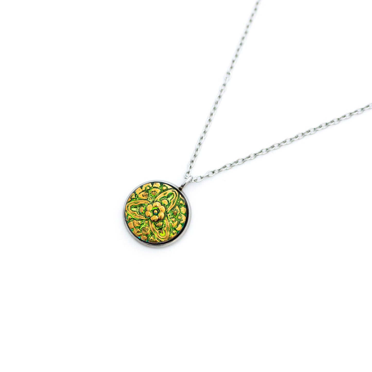 Green and gold painted Czech glass button with 3 point floral motif. Button pendant necklace.