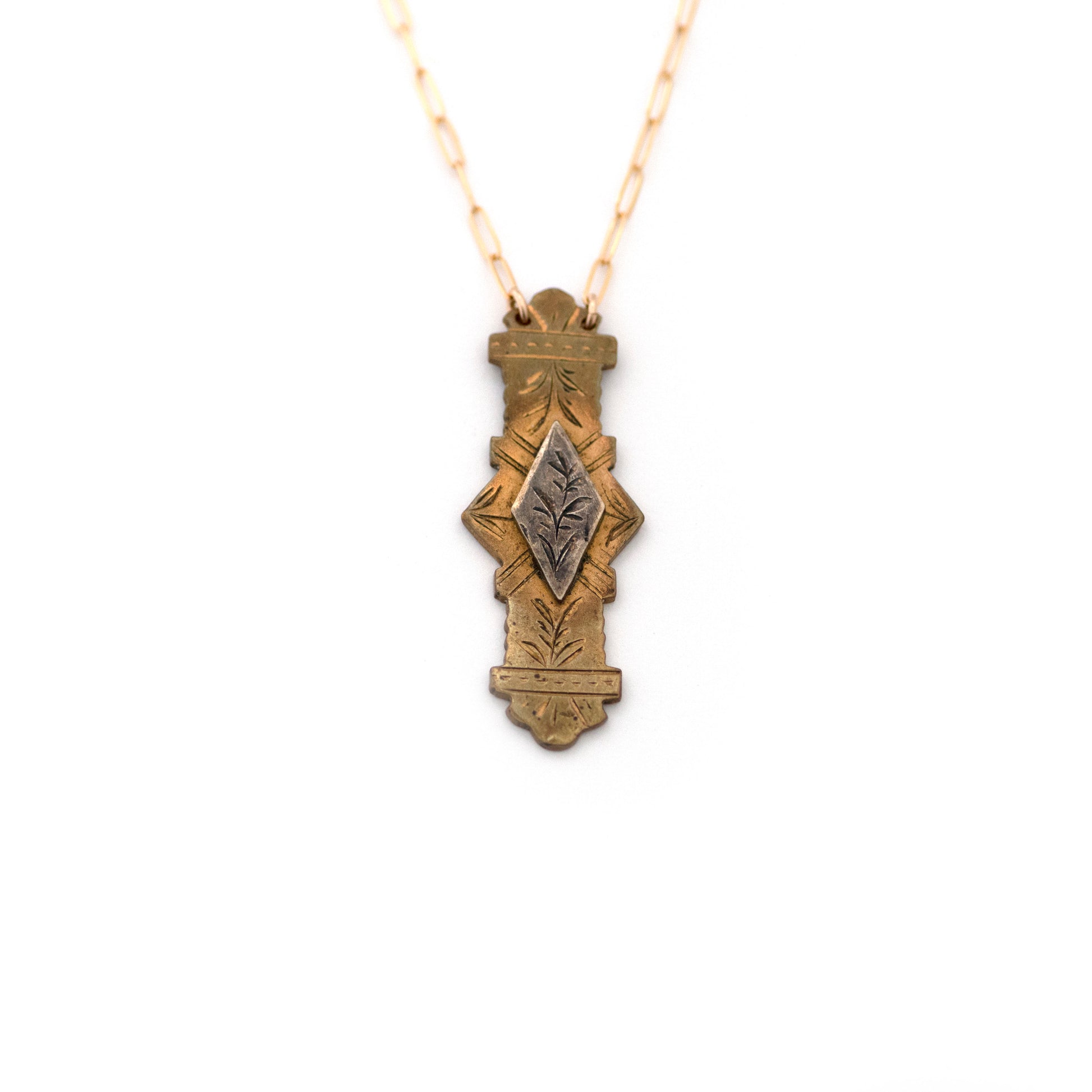 This one-of-a-kind conversion necklace is made up of:  Sterling on Brass Victorian bar pin pendant from the late 1800s with hand engraved details. Pendant measures 0.6" wide and 1.6" tall. Aesthetic Movement.