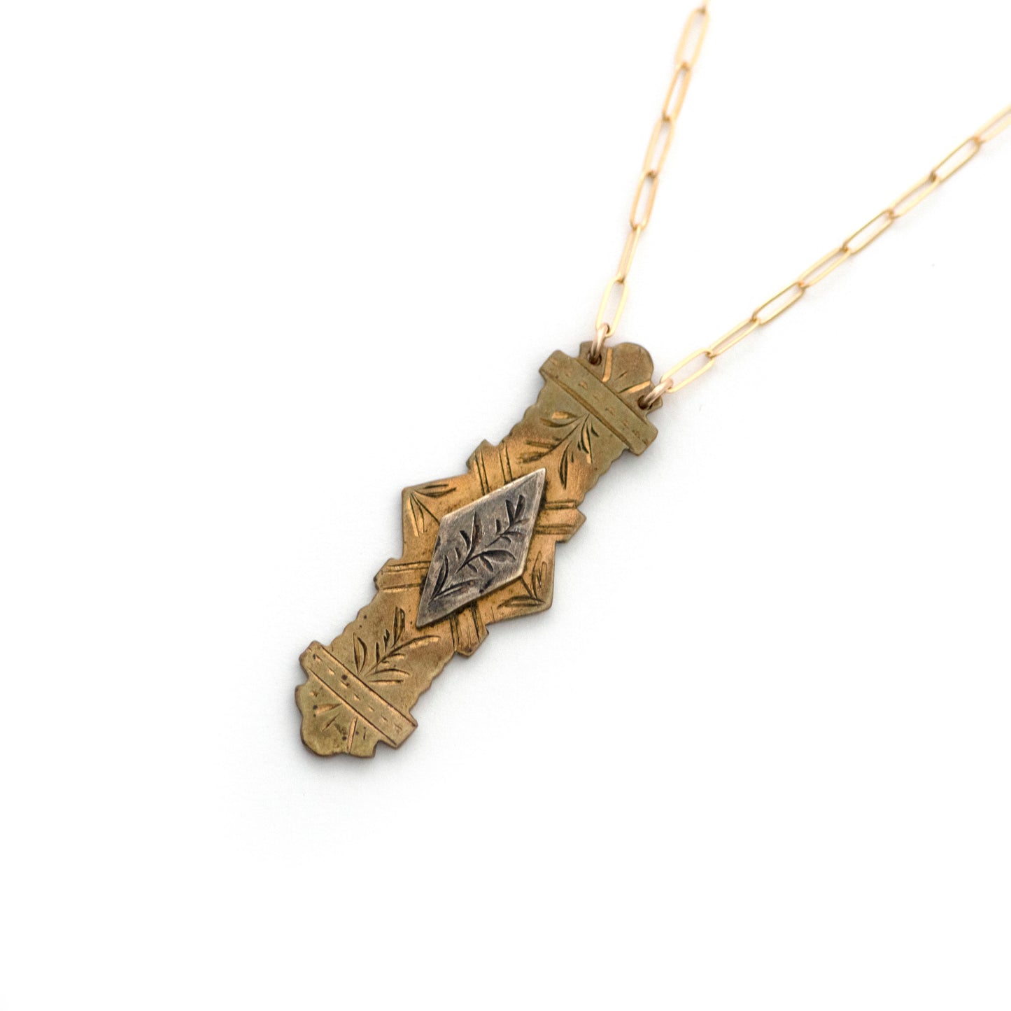 This one-of-a-kind conversion necklace is made up of:  Sterling on Brass Victorian bar pin pendant from the late 1800s with hand engraved details. Aesthetic Movement.