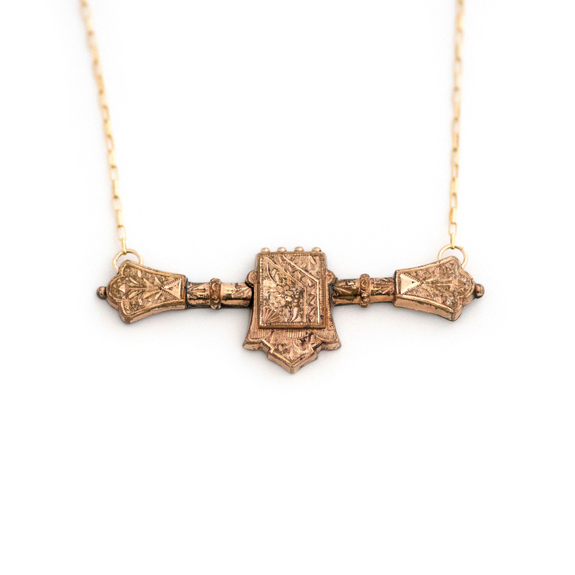 This one-of-a-kind conversion necklace is made up of:  Gold filled Victorian bar pin pendant from the late 1800s with hand tooled details including floral accents.