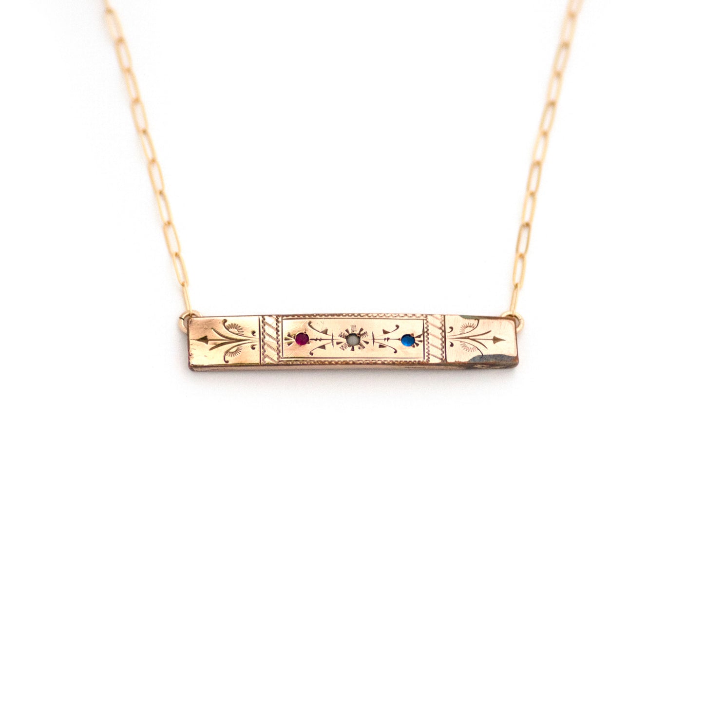 This one-of-a-kind conversion necklace is made up of:  Gold filled Victorian bar pin pendant from the late 1800s with hand tooled details and red, white and blue glass accents.