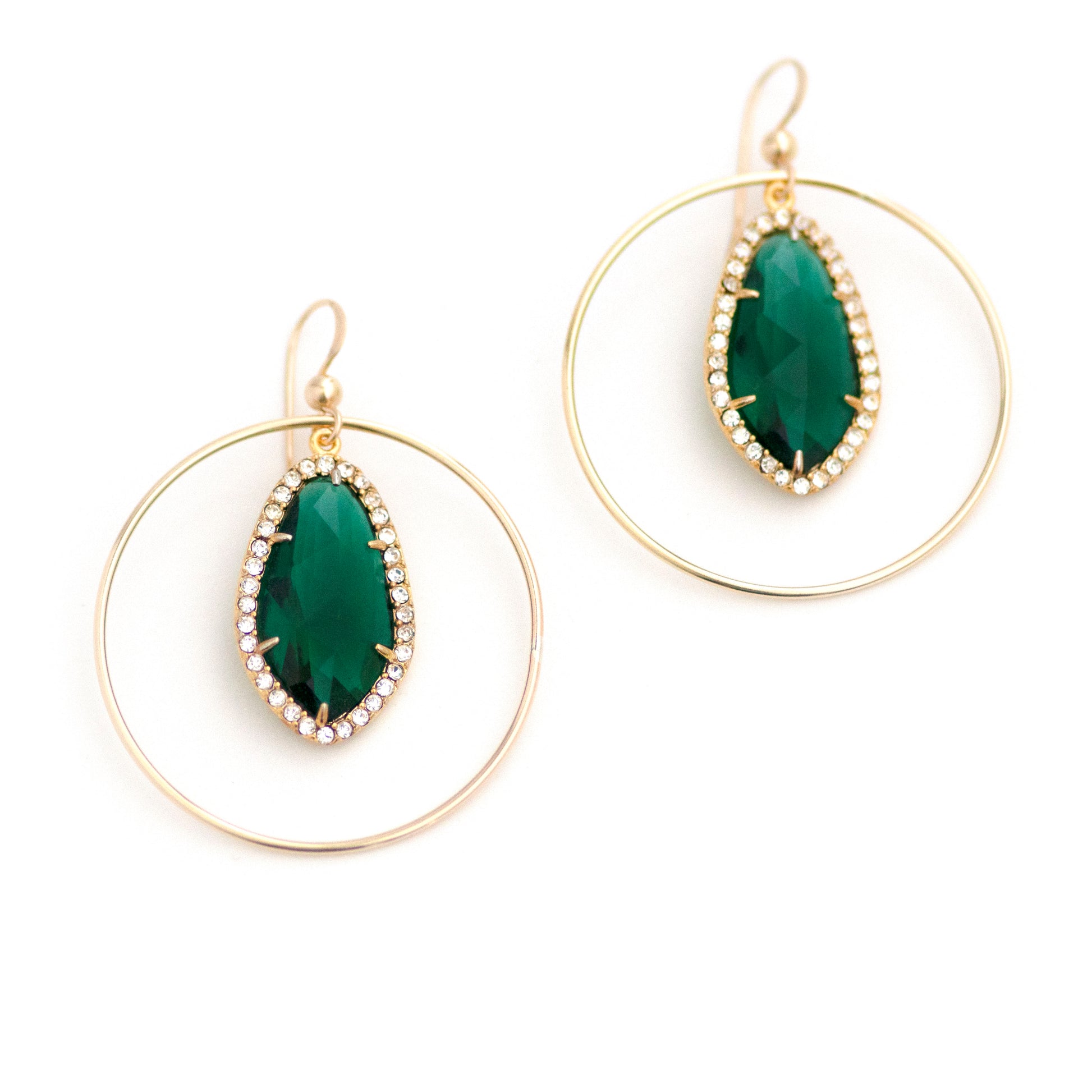 These upcycled vintage earrings are made up of:  Gold tone vintage emerald green crystal rhinestone drops and 14k gold fill.