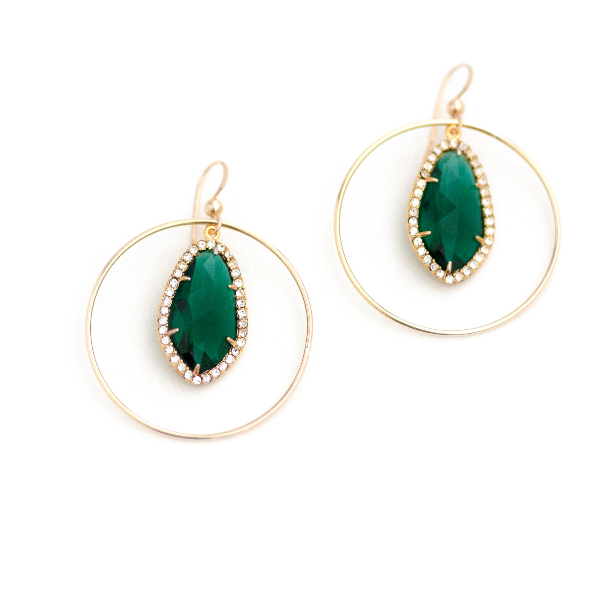 These upcycled vintage earrings are made up of:  Gold tone vintage emerald green crystal rhinestone drops and 14k gold fill.