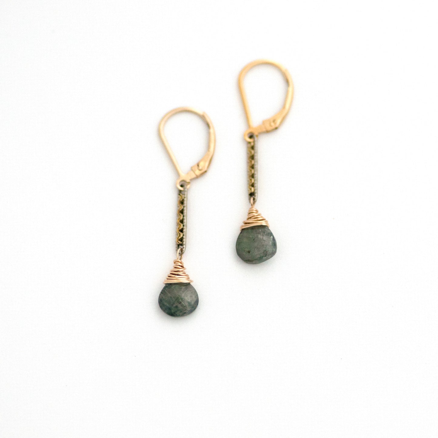 These one-of-a-kind conversion earrings are made up of:  Gold filled and silver tone Edwardian watch chain links from the early 1900s with hand tooled details. Moss aquamarine.