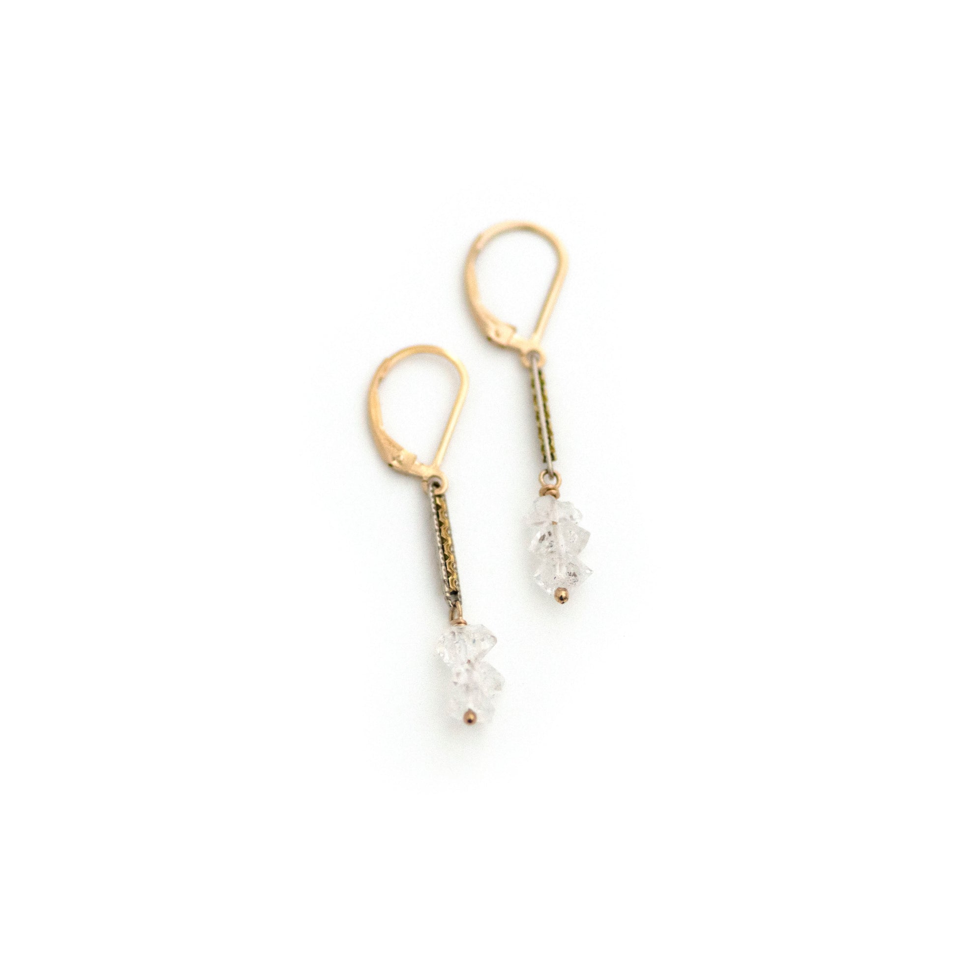 These one-of-a-kind conversion earrings are made up of:  Gold filled and silver tone Edwardian watch chain links from the early 1900s with hand tooled details. Herkimer diamonds.
