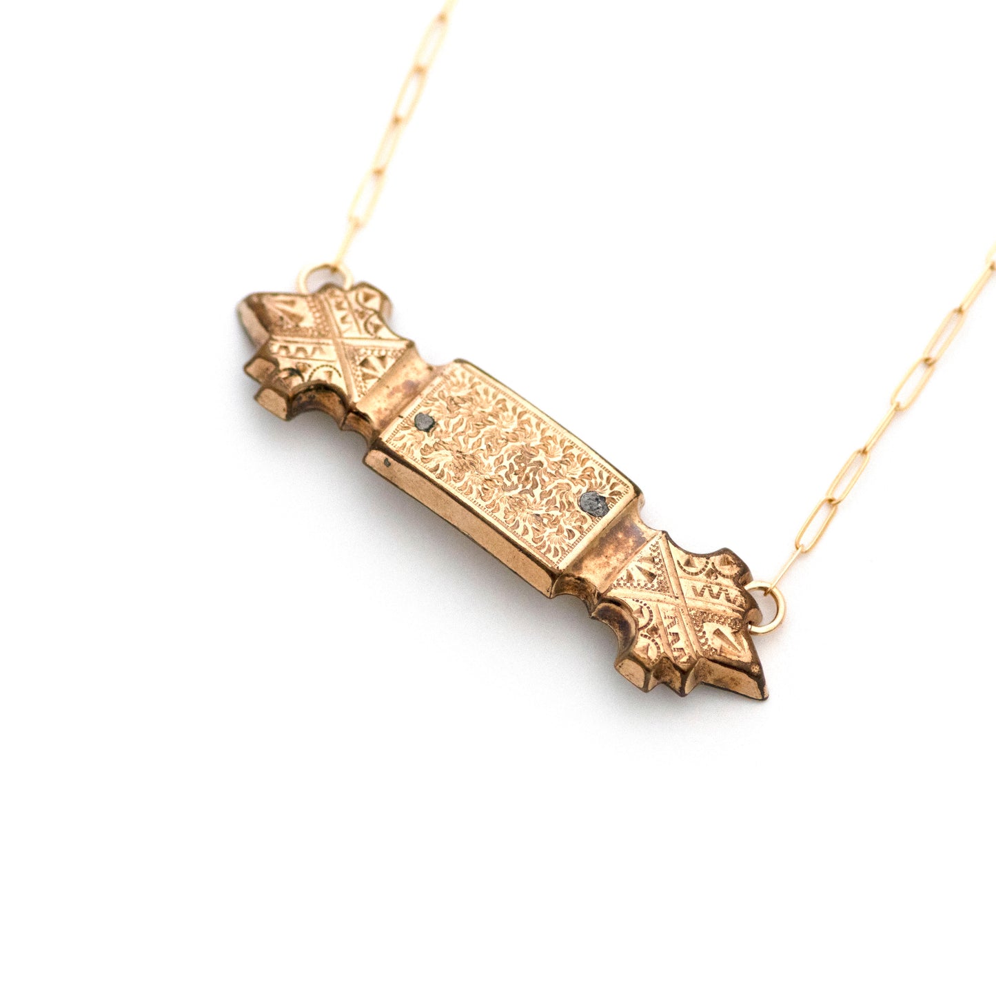 Gold filled Victorian bar pin pendant from the late 1800s with hand tooled details. Bar pendant has a mild convex curve from the front. Two solder marks are indications of a life well lived.