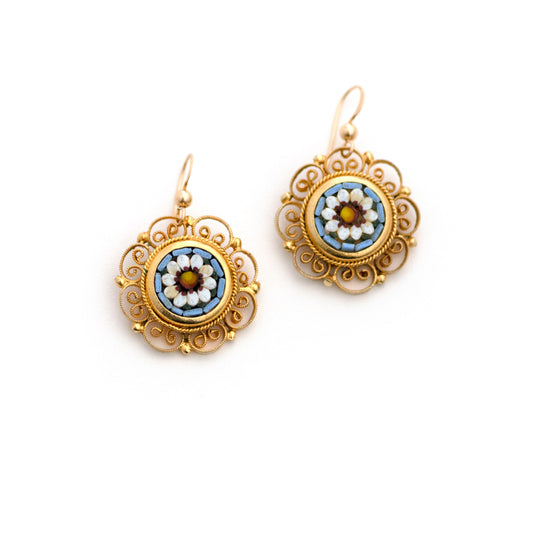 A pair of beautiful gold-tone vintage Italian micro mosaic screw back earrings has been converted into earrings for pierced ears. Micro mosaic glass puzzle depicts white flowers against a baby blue background.