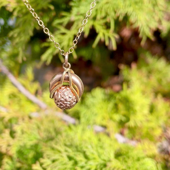 video demonstrating the movement of the rolling ball of the antique rolling ball gold filled pendant necklace