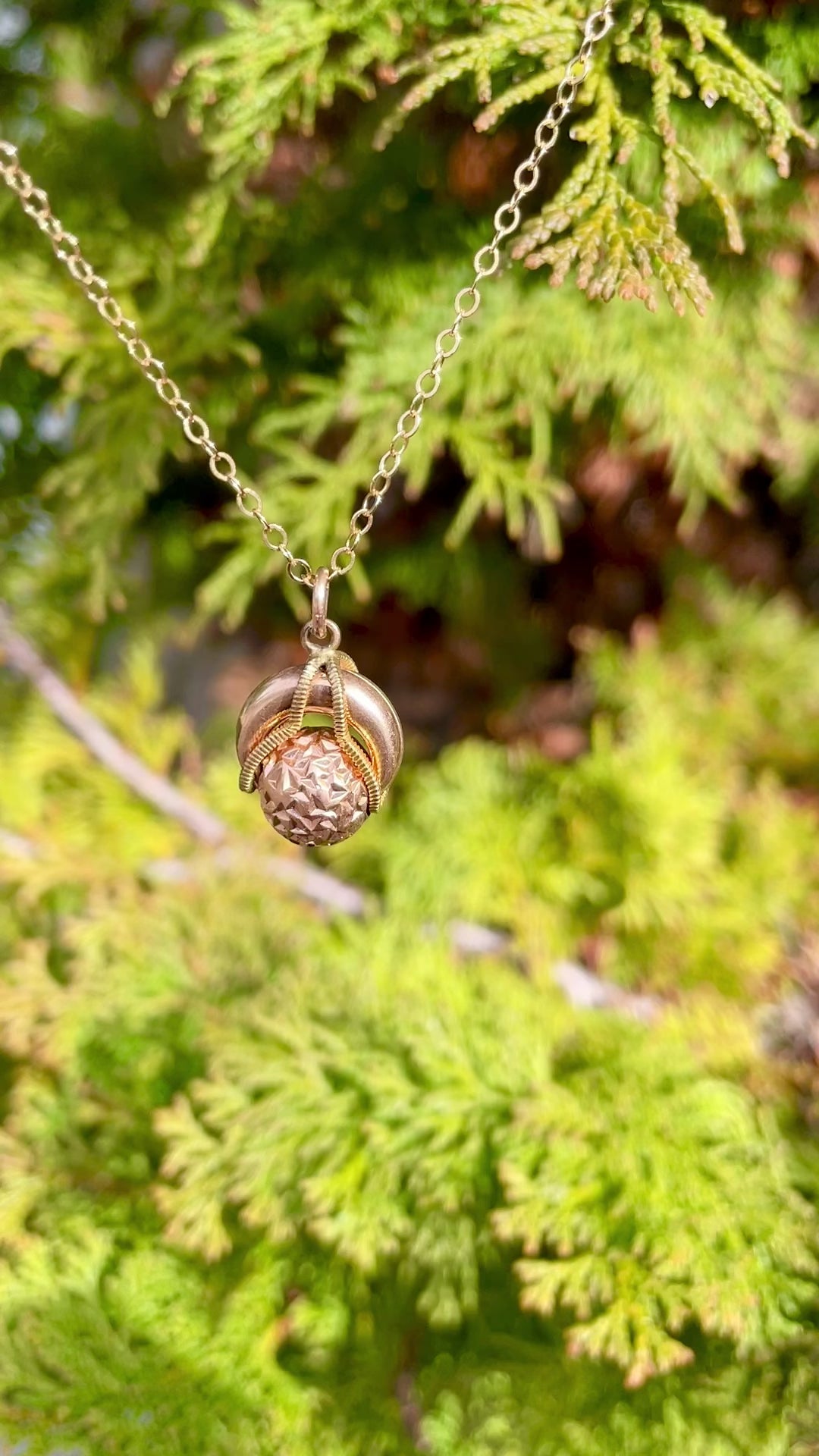 video demonstrating the movement of the rolling ball of the antique rolling ball gold filled pendant necklace