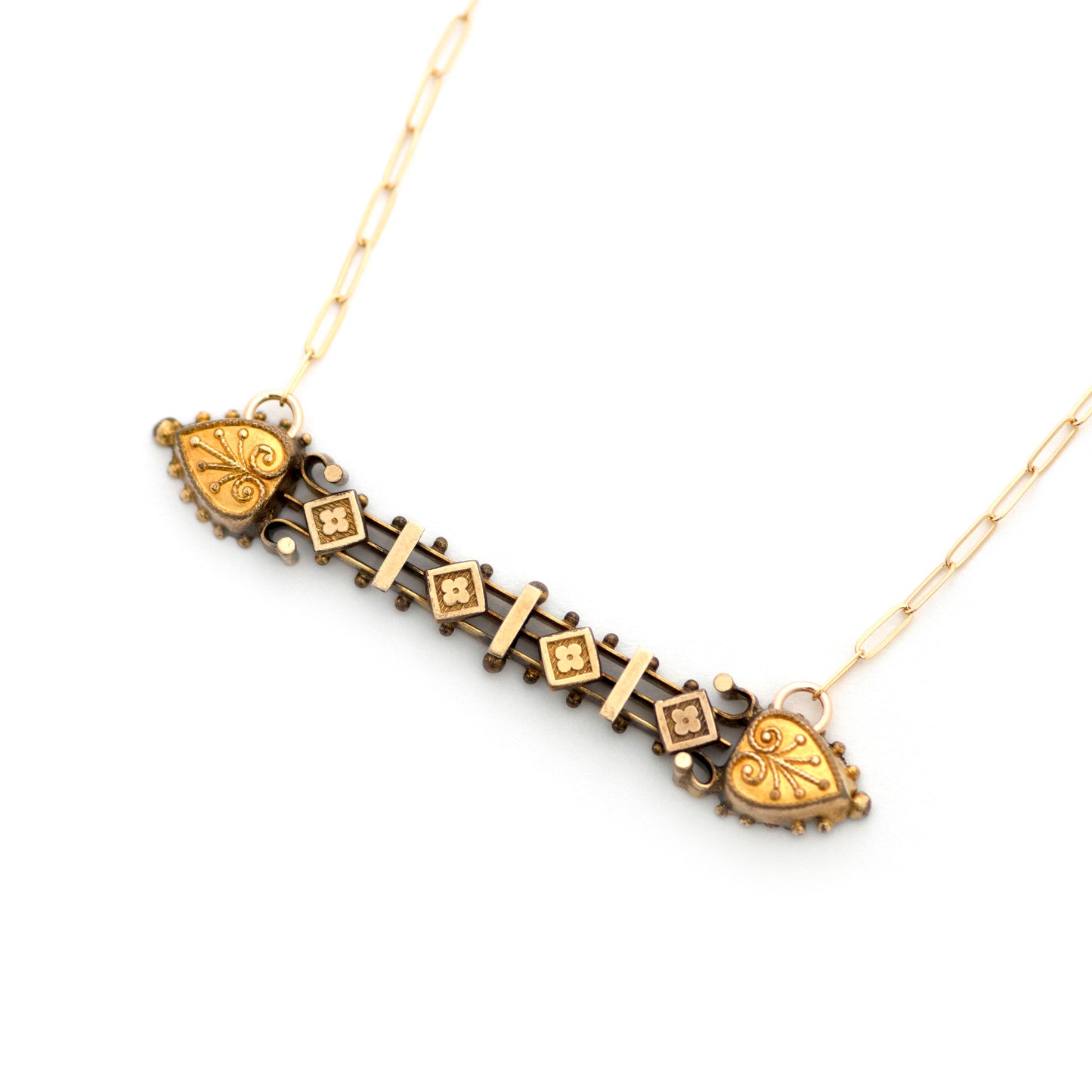 This one-of-a-kind conversion necklace is made up of:  Gold filled Victorian bar pin pendant from the late 1800s with Etruscan Revival filigree details. Pendant measures 2.3" wide.  New 14k gold filled chain