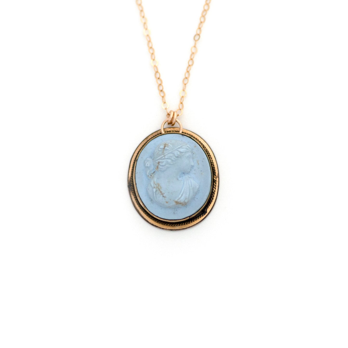 This antique conversion necklace is made up of:  Gold filled Victorian cuff link from the late 1800s with a pale blue porcelain cameo on a 14k gold filled chain.