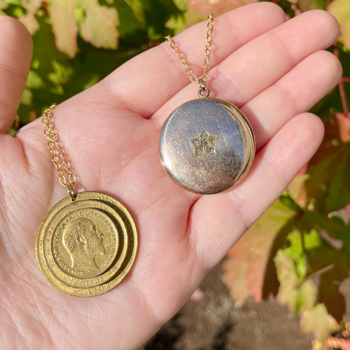 front of two antique locket necklaces